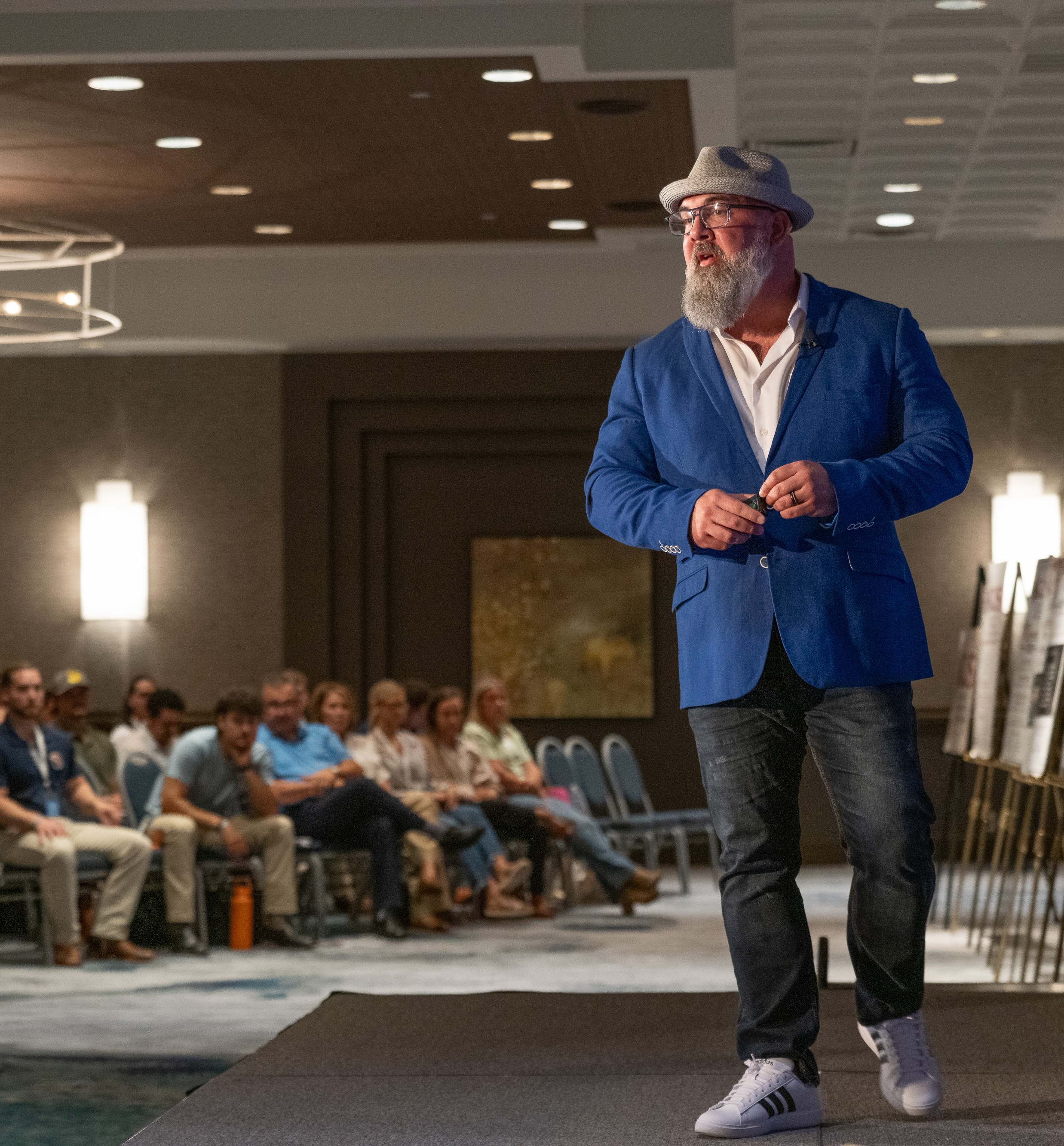 Billy Sticker speaking on stage